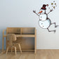 Snowman wall decal with top hat, scarf, and star accents, jolly jumping pose