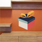 Christmas gift present sticker with geometric multi-color box and ribbon