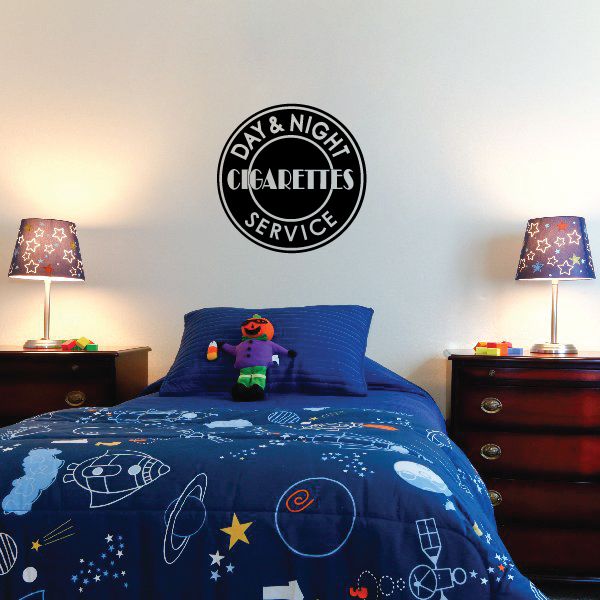 Circular “DAY & NIGHT CIGARETTES SERVICE” decal in black and white