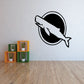 Black whale silhouette inside a white-outlined circle wall decal