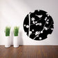 Circular bird and floral wall decal, black background with white silhouettes