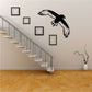 Black and white crow wall decal with wings spread, circular flying design.