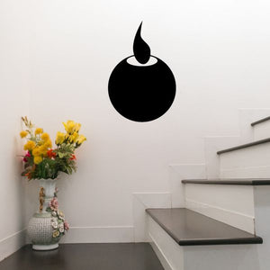 Circular candle decal with black flame silhouette