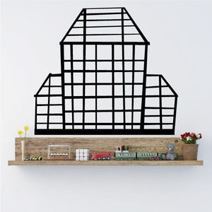 City building wall decal with black grid facade and arched front window.
