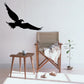 Flying hawk decal in black silhouette, long wings and pointed beak