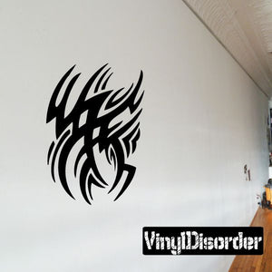 Black tribal vinyl wall decal with flame-like head silhouette