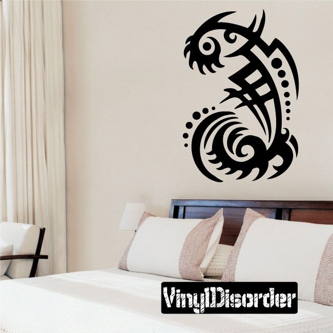 Black tribal vinyl wall decal featuring a stylized fish with circular wave pattern