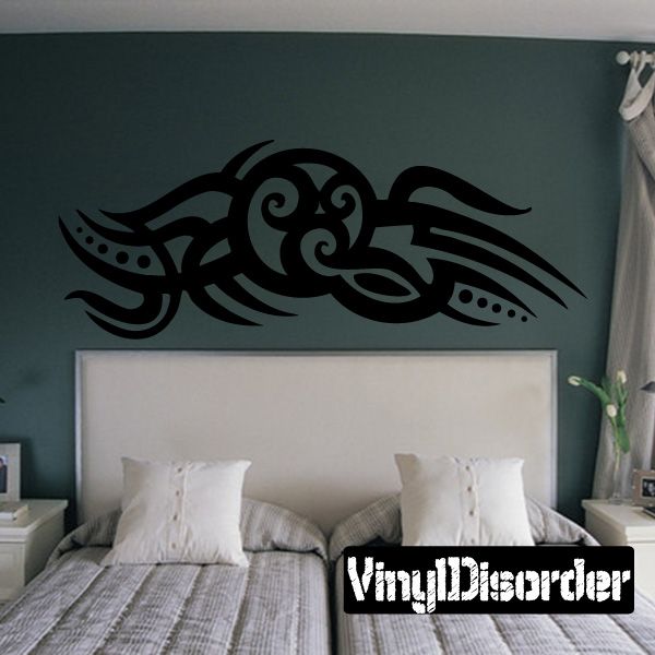 Tribal vinyl wall decal with black stylized bird and swirling patterns
