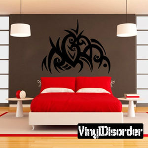 Vinyl tribal wall decal with black ornamental pattern, centered on wall above bed