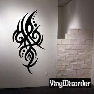 Tribal vinyl wall decal with black curving swirl and dot accents