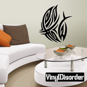 Tribal vinyl wall decal featuring black feather motifs on a light wall