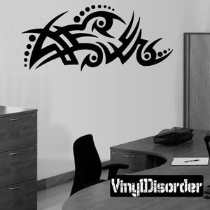 Black tribal wall decal with swirling eye pattern, vinyl