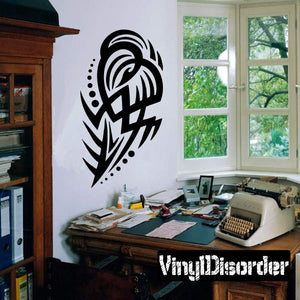Tribal vinyl wall decal featuring black bird-like mask and feather design
