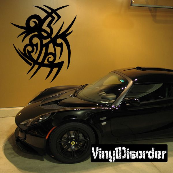 Vinyl tribal wall decal with black stylized tribal symbol on wall