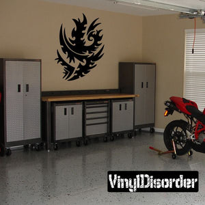 Tribal wall decal featuring a stylized flame/dragon emblem in black