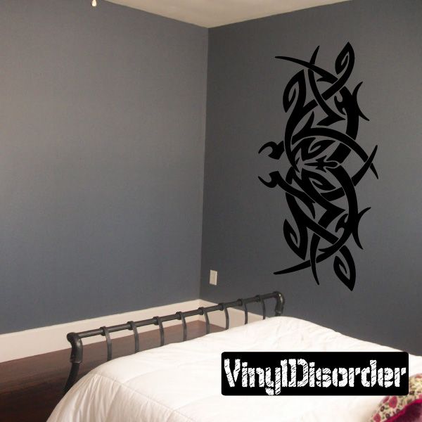 Tribal vinyl wall decal in black with interwoven arrow and leaf motifs