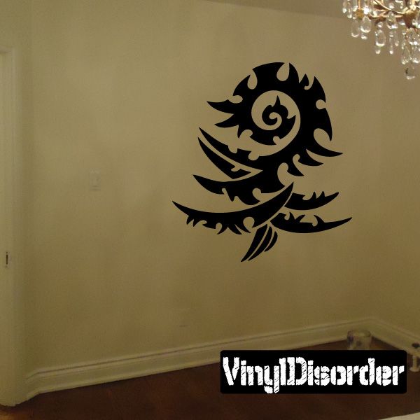 Black tribal swirl vinyl wall decal with flame-like curve and spiral