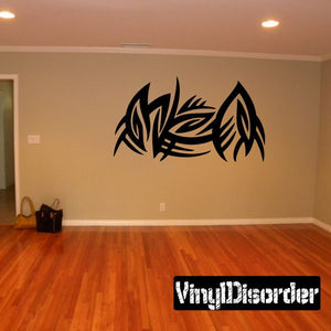 Tribal vinyl wall decal with bold black feather and leaf shapes