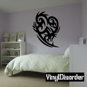 Tribal vinyl wall decal in black with stylized bird face and wings