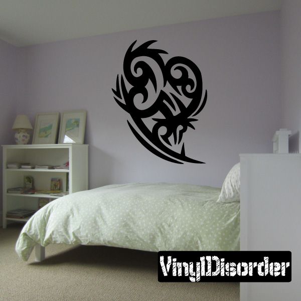 Tribal vinyl wall decal in black with stylized bird face and wings