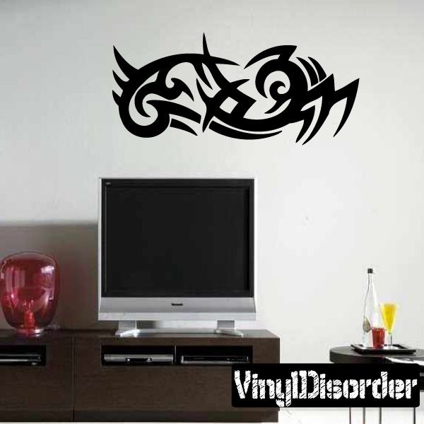 Black tribal vinyl wall decal with scrolling dragon-like pattern