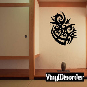 Black tribal wall decal with ornate scroll pattern, vinyl sticker for indoor walls.
