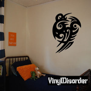 Black tribal wall decal featuring a stylized bird head with flowing feathers