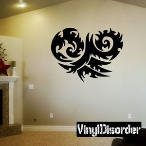 Black tribal wall decal with swirling dragon-like curls, vinyl sticker design