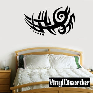 Black tribal wall decal with swirl-and-eye circular design