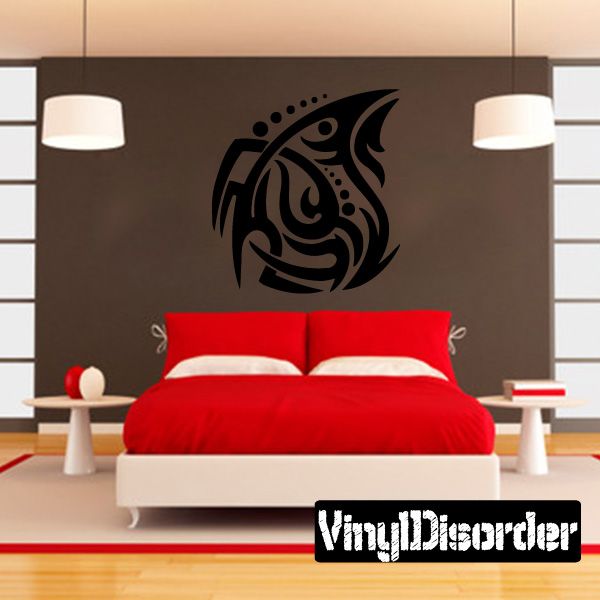 Tribal vinyl wall decal with black swirl figure on a light wall