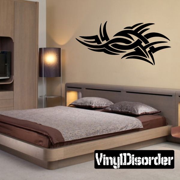 Tribal vinyl wall decal with black stylized winged design for walls