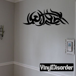 Tribal vinyl wall decal with black Arabic-style calligraphy, curved script