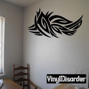 Tribal vinyl wall decal with black stylized eagle wings on wall