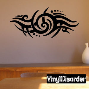 Black tribal swirl wall decal with curved tribal lines and small dot accents