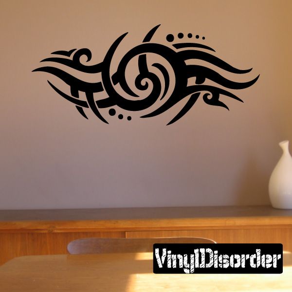 Black tribal swirl wall decal with curved tribal lines and small dot accents