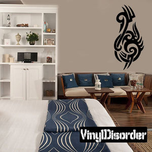 Tribal vinyl wall decal with black flame-like ornament on a light wall