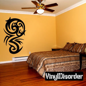 Black tribal vinyl wall decal with curving swirl pattern