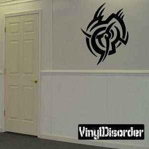 Tribal vinyl wall decal with black bird-like spiral emblem