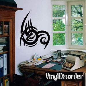 Black tribal vinyl wall decal with stylized spiral emblem