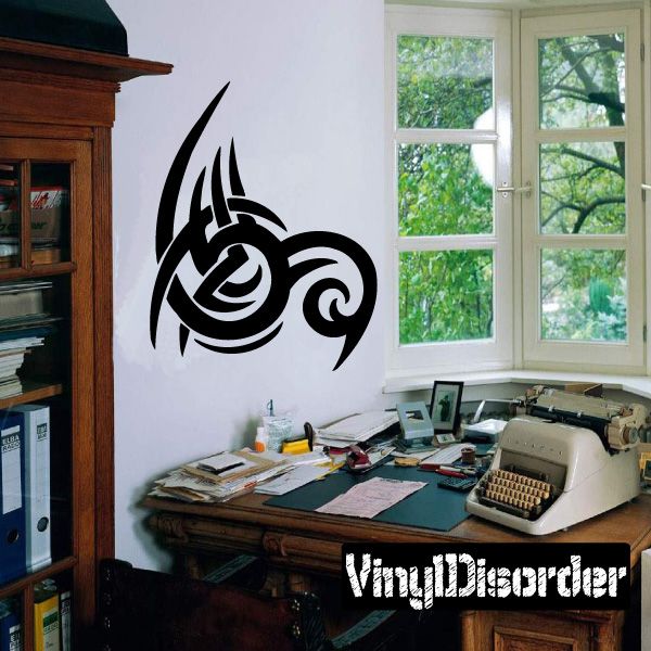 Black tribal vinyl wall decal with stylized spiral emblem