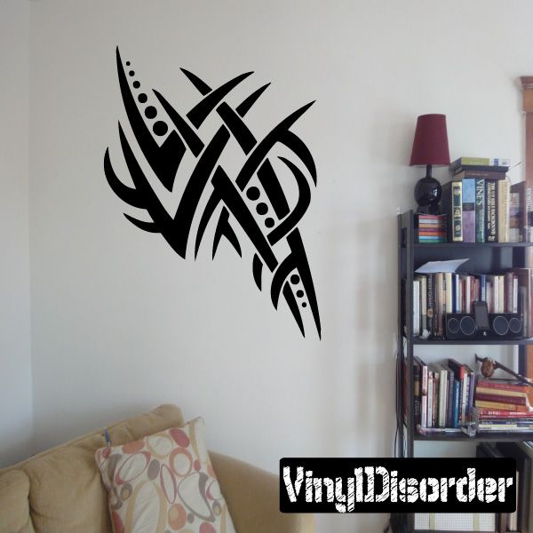 Black tribal vinyl wall decal with stylized cross-like knot and flame shapes