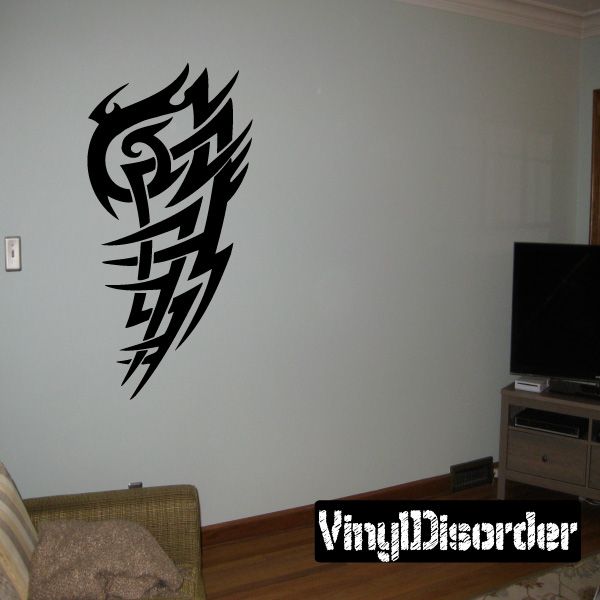 Tribal vinyl wall decal with black winged emblem and swirling tribal lines.