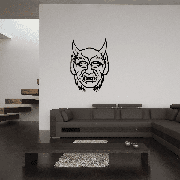 Devil mask decal with black outline artwork on a light surface