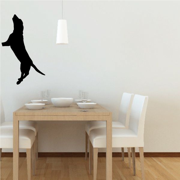 Climbing dog decal, black dog silhouette climbing upward.