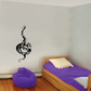 Climbing snake wall decal, black and white coiled design.