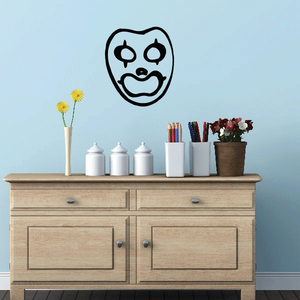 Clown mask decal with black outline and white face, stylized grin and round eyes