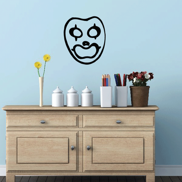 Clown mask decal with black outline and white face, stylized grin and round eyes