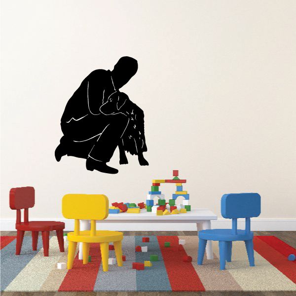 Black comforting dog wall decal, dog kneeling and hugging a child