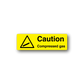 Yellow caution compressed gas sticker with warning triangle icon and text