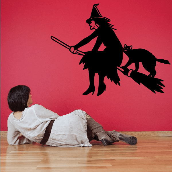 Image of Confident Witch Riding Broom with Cat Decal